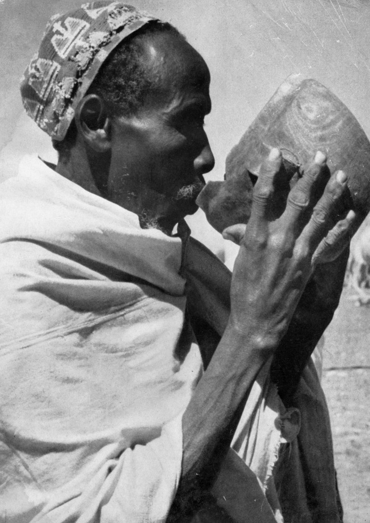 Somali nomad drinking camel milk